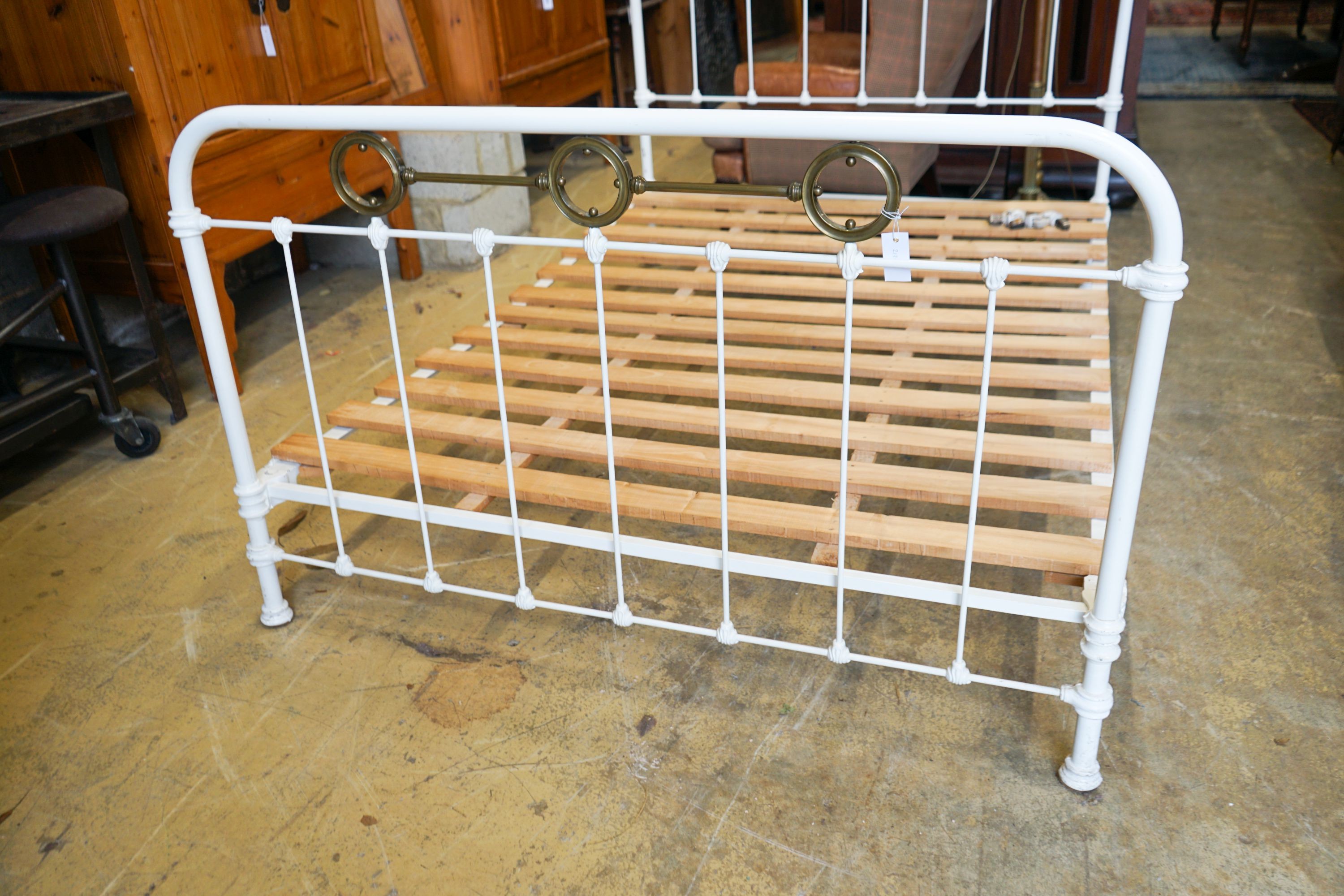 A large late Victorian iron and brass bed frame, width 140cm, length 196cm, height 130cm